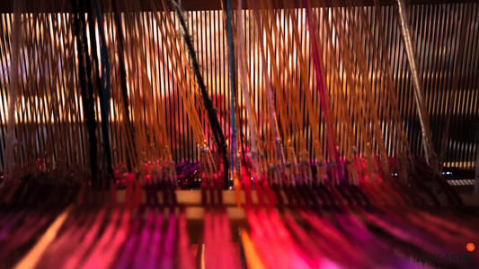 Handloom weaves in red, pink, purple and yellow threads
